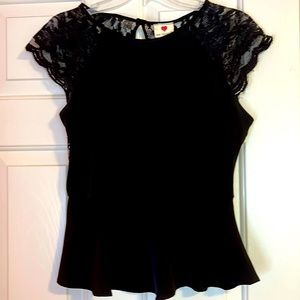 Black peplum shirt sleeve blouse.